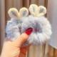 002 Пара плюшевых резинок для волос с синими кроличьими ушками.