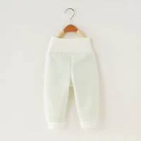 Светло -зеленые и высокие брюки для талии