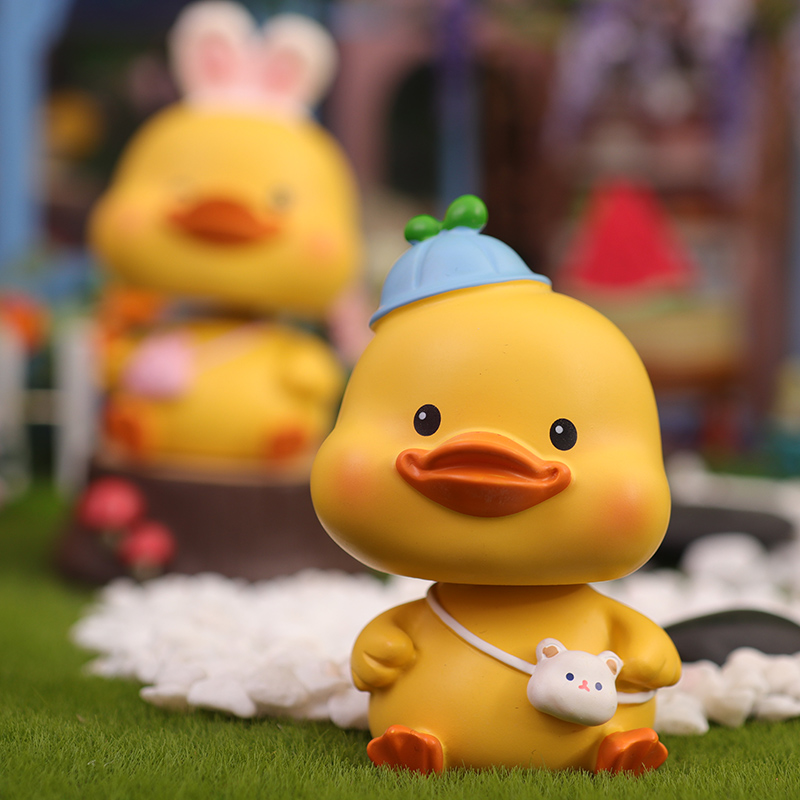 Cute little yellow duck car ornament shaking head doll car car duck office desktop decoration school gift