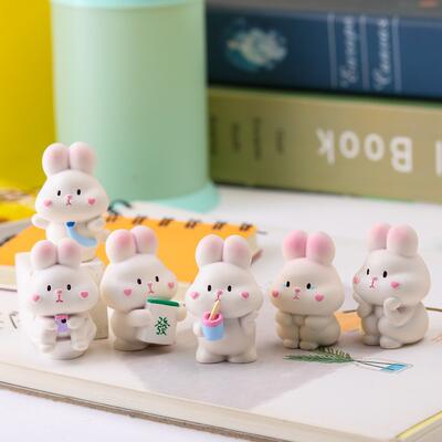 The 2023 new car interior decoration features a high-end center console with cute rabbit figurines that are popular among both male and female car owners