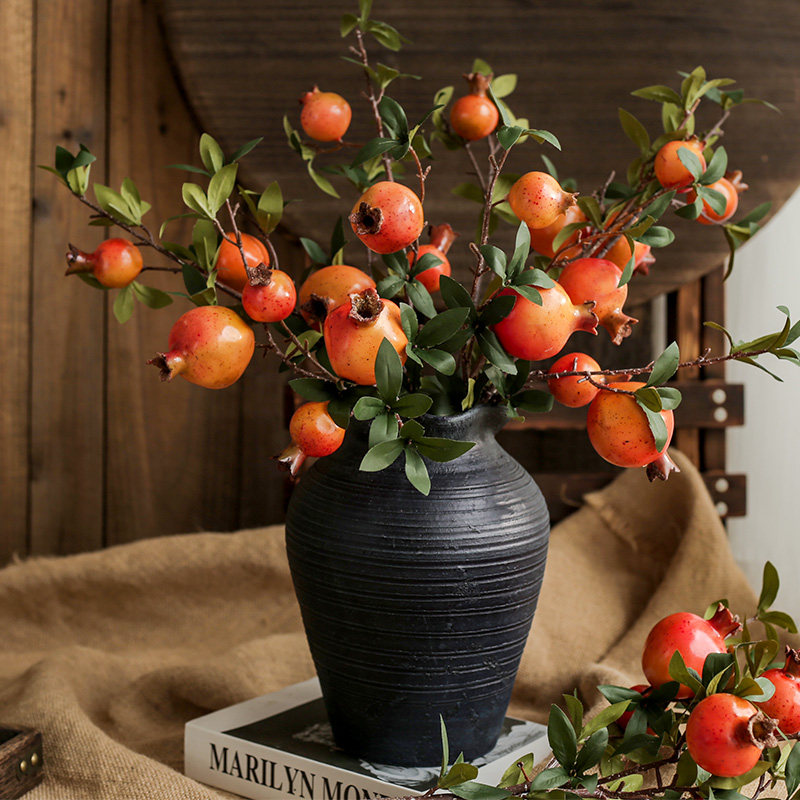 Flower-room dining table decorated flower arrows arrows and flower arrows dry flower tree branches in wild pomegranate