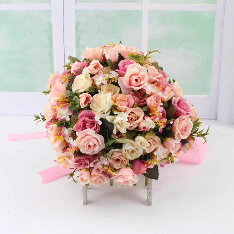 Wedding emulation hand held bridal wedding dress photo by hand to hold florist Han style champagne pink rose to take pictures and fake flowers