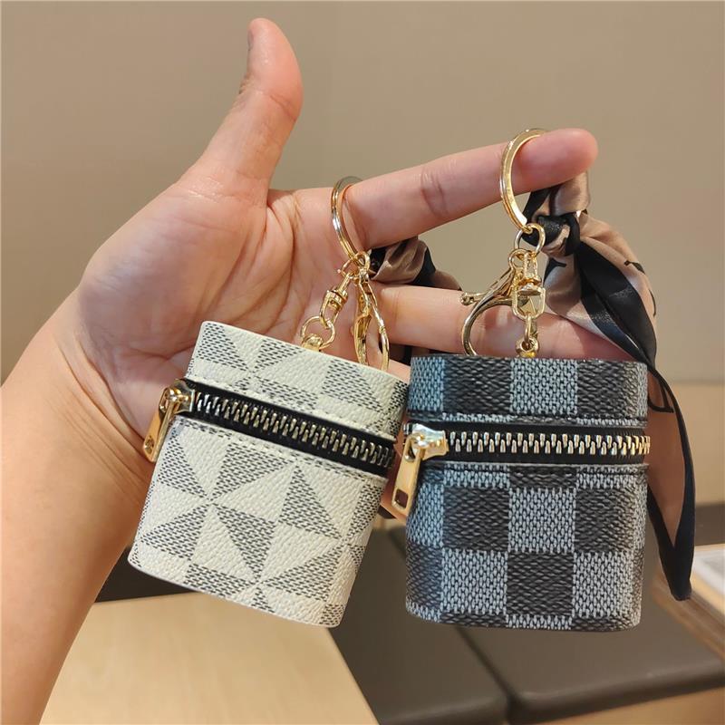 Suitable for Lv Coin Purse Car Keychain Mini Old Flower Color Portable Cosmetics Bag Wireless Headphone Protective Cover
