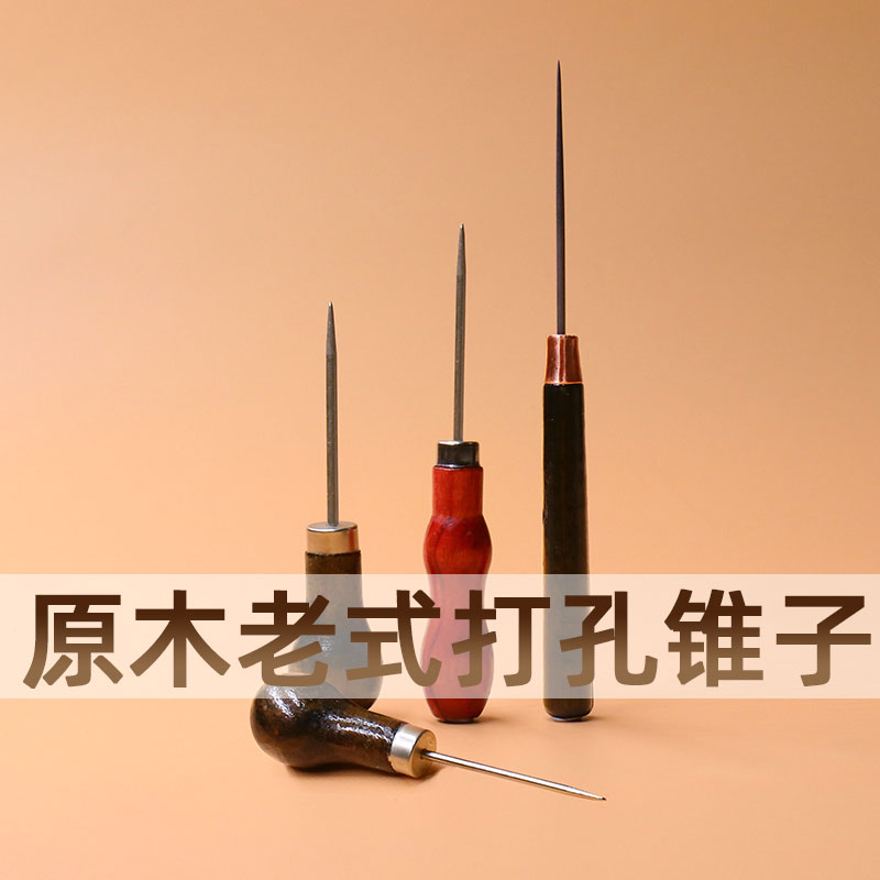 Old wood handle taper needle shoe soles hand hole punched eye on shoe line upside corner cone needle