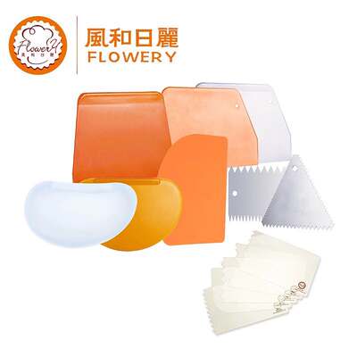 On a sunny and breezy day, a scraper for baking with serrated hard plastic aluminum alloy cake cream tools, a soft scraper for home kitchens