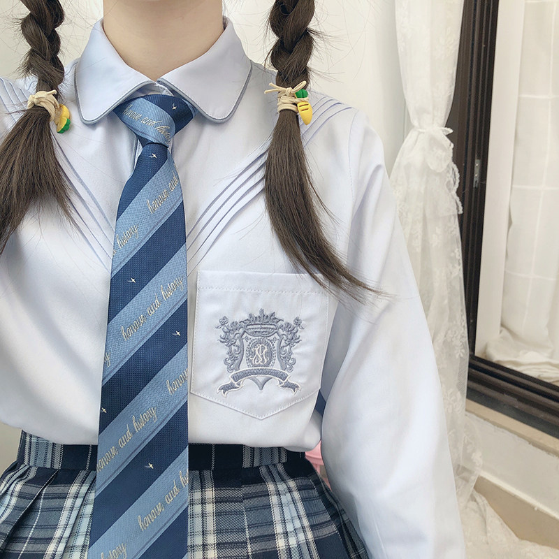 JK's original uniform and long sleeved Japanese shirt at the foot of the Royal Medal