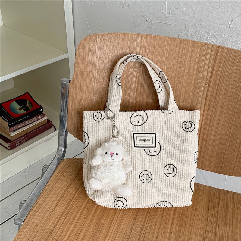 The new Korean ins waterproof mini portable canvas bag all-match hand bag go out portable storage bag hand bag