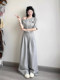 Korean age-reducing casual sportswear suit for women in summer, simple waistline, one-line shoulder, slanted shoulder, short-sleeved skirt, two-piece set