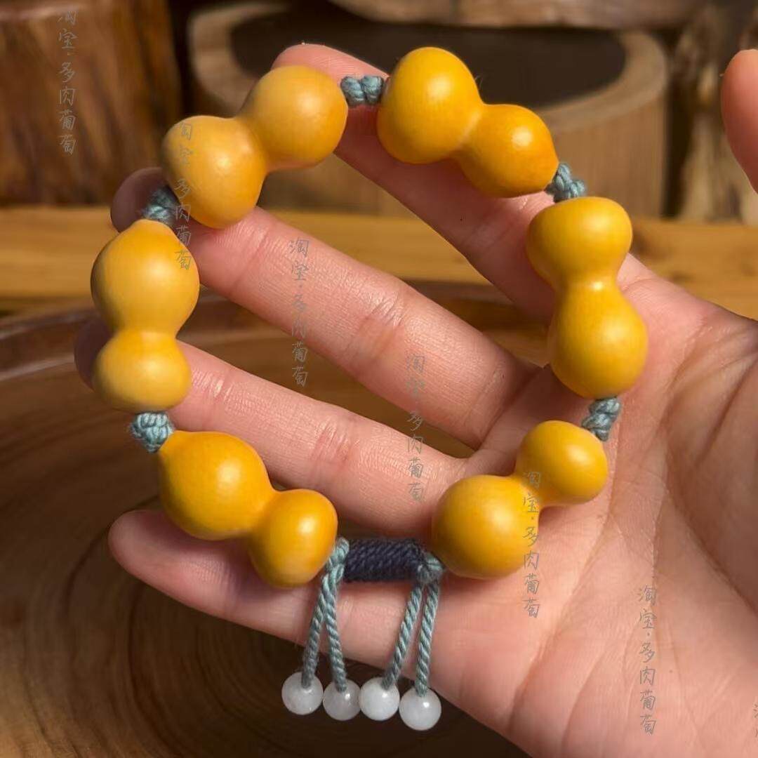 文玩葫芦手串怎么选?天然手捻把玩神器,草里金小葫芦真能盘出包浆吗?-葫芦-淘宝百科网