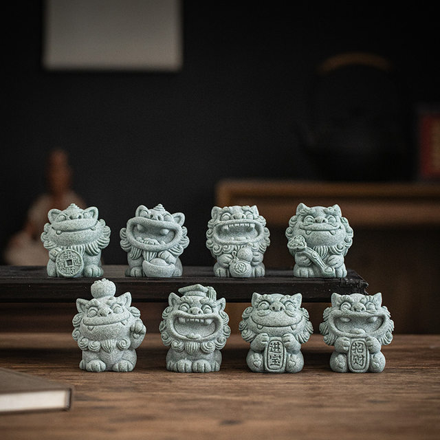 A Pair of Cute Green Sandstone Wind Lion Statues, a National Trend Stone Lion, a Lucky Charm, Tea Pet Ornament, and Souvenir