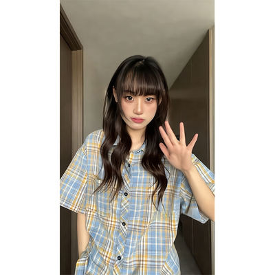 A plus-size, chubby girl's plaid short-sleeved shirt for women's summer with loose ice silk and a laid-back style. The design is unique and unconventional