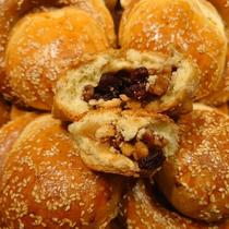 Xinjiang handmade naan specialty snacks traditional baked Chinese pastries raisins walnuts milky and crispy