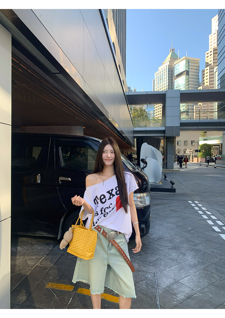 Стильные женские джинсы средней длины с эффектом потертости 牙套大汪