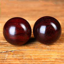 Indian lobular red sandalwood health ball holds fitness ball and handball. The old man massages the ball. The dribbling hand spins the ball and plays with the ball.