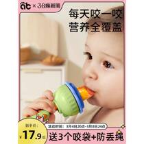 Baby bites fruit and vegetable bag eats fruit food supplement bites and plays with pacifier baby juice artifact teether molar stick