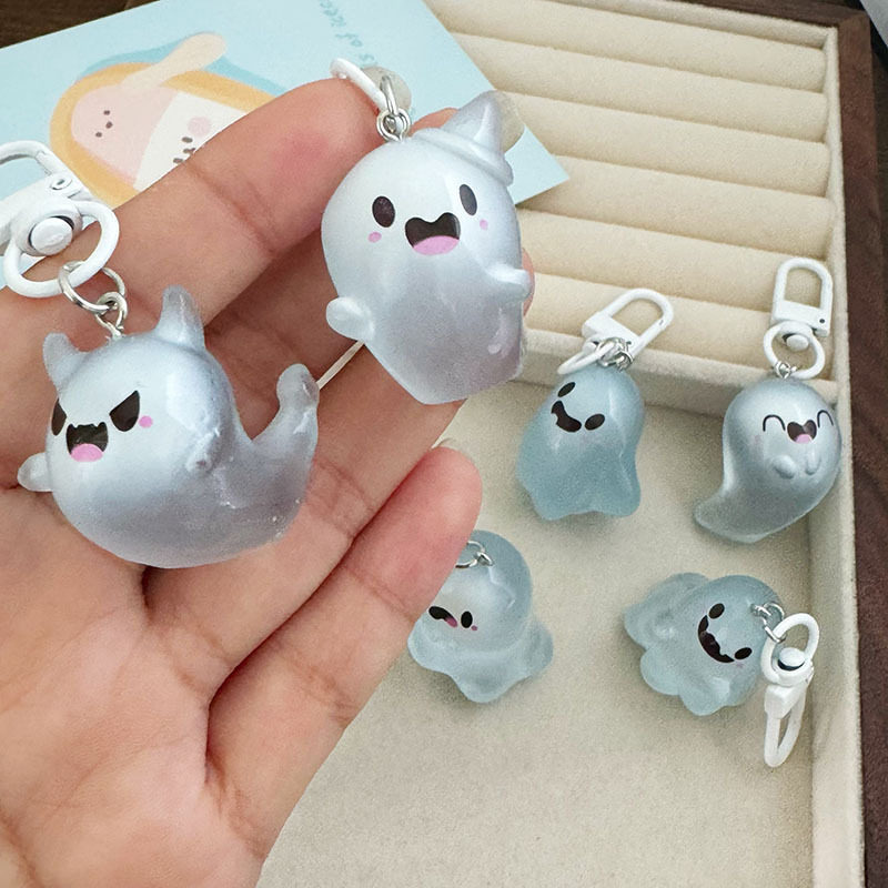 Halloween glow-in-the-dark ghost keychain, 3D cartoon transparent couple elf pendant, cute accessory for backpacks.