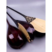 Xinjiang Musical Instruments a Kazakh-made musical instrument Dombula plays the standard piano pine wood instrument students practice the piano