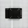 Perforated board computer screen stand saves space
