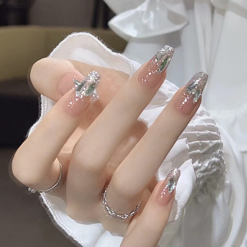 Handmade Long False Nails with Fine Glitter, Gradient, Dazzling Large Rhinestones, Elegant Nude Color, and Skin-Brightening Effect
