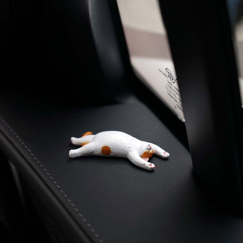 A Cat Lying by the Window Is a Mini and Cute Car Decoration, a Creative Ornament for the Dashboard, Door, or Window Display