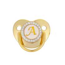 Factory direct sales baby gold 26 letter soothing pacifier weaning artifact baby soothing toy mouth