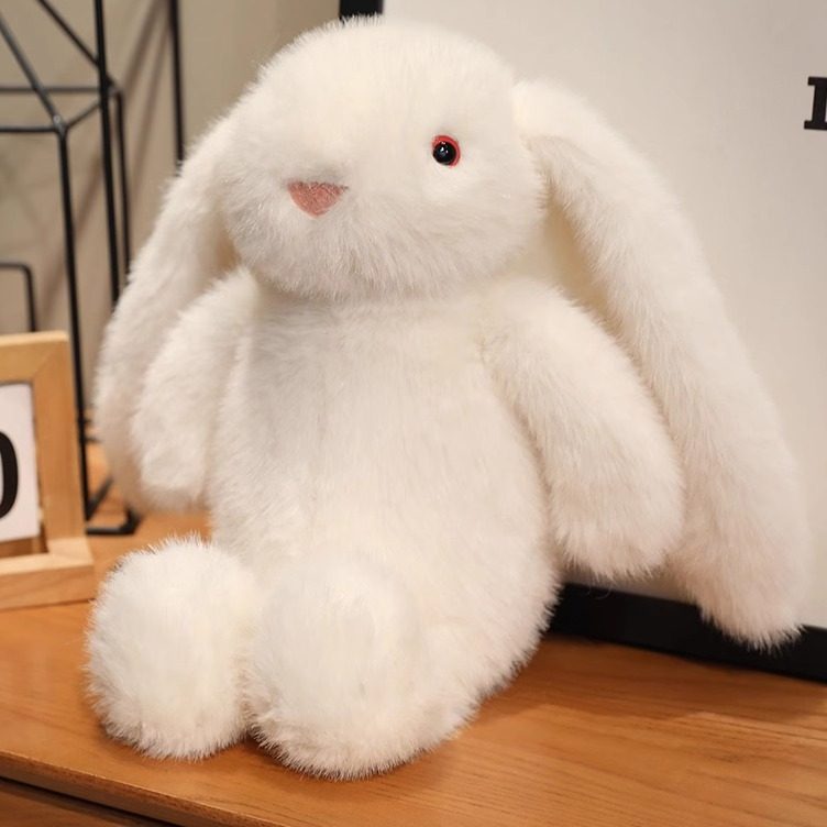 耳が垂れた大きな白いウサギのぬいぐるみ。抱き心地の良いウサギのぬいぐるみで、ガールフレンドや子供へのプレゼントに最適です。