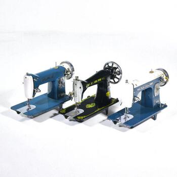 Collection of folk nostalgic objects, miscellaneous old-fashioned desktop sewing machine heads, old farm tools, textile decorative ornaments, antiques