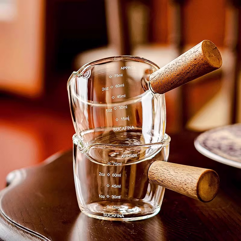 Heat-Resistant Glass Mini Milk Jug with Wooden Handle and Scale for Espresso, Condiments, and Pouring Milk Heat-Resistant Glass Mini Milk Jug with Wooden Handle and Scale for Espresso, Condiments, and Pouring Milk