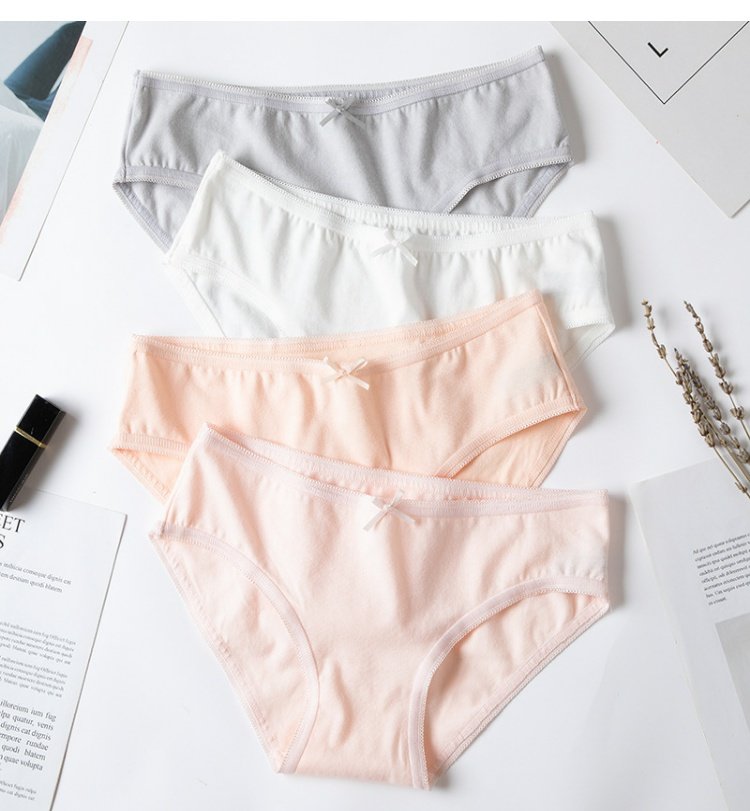 Bow vải cotton thoáng khí cô gái liền mạch cotton đồ lót nữ thấp eo sinh viên bán buôn quần lót lọt khe xẻ đũng