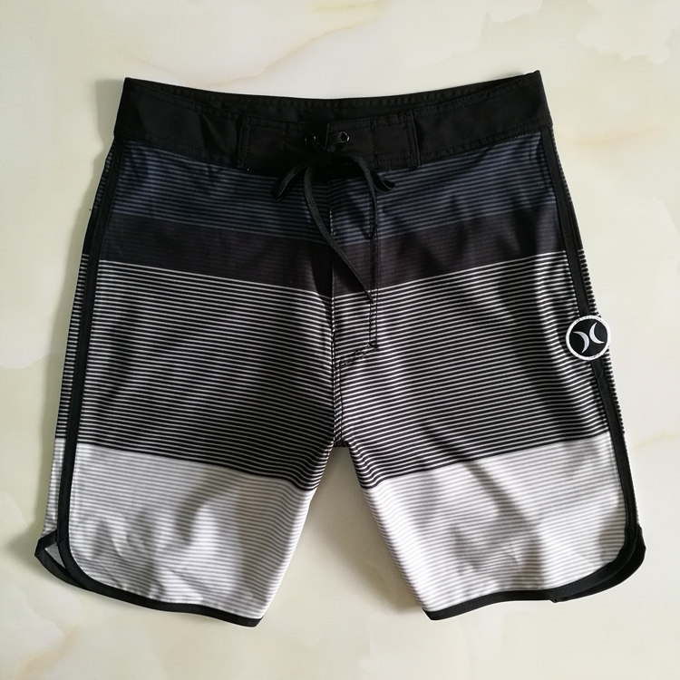 New foreign trade beach pants couples wear quick-drying loose large-size seaside surf shorts hot springs can be launched swimming trunks