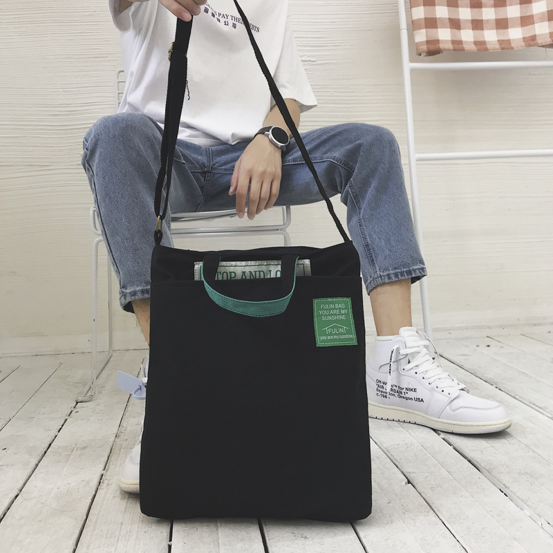 2021 new shoulder bag men's tide canvas Hong Kong wind cloth bag handbag casual backpack simple hand carrying backpack men