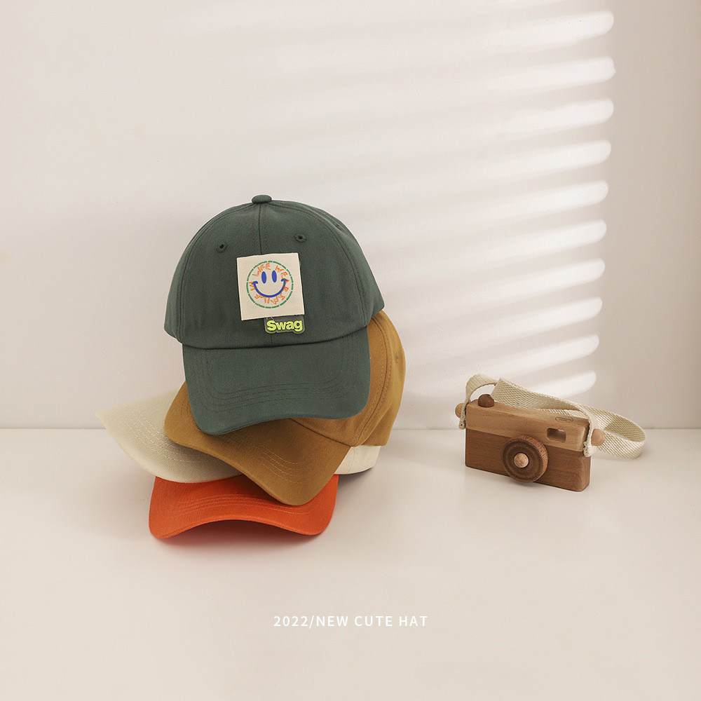 Spring and summer new children's hats smiley face cloth standard trend boys and girls peaked caps travel wild baby baseball caps
