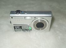 Машина с зарядной камерой Pentax Binder Optio T10 с точкой на месте