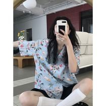 East Day is a curly Hawaiian colorful printed shirt female summer blouse with a small crowdsourced design.