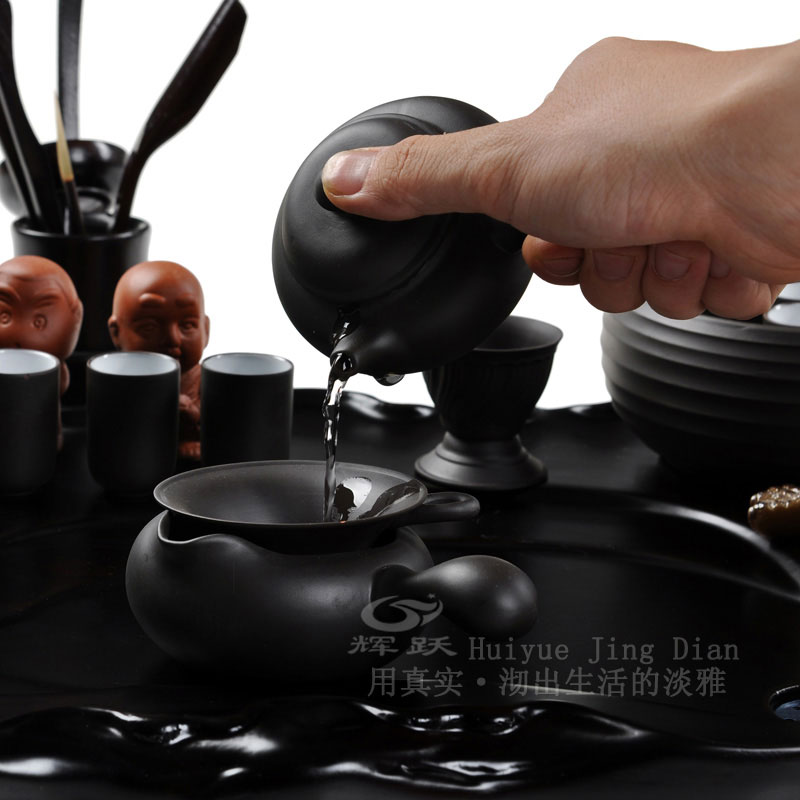 Hui make yixing purple sand of a complete set of kung fu tea set laughing Buddha maitreya wing real wood the tea tray