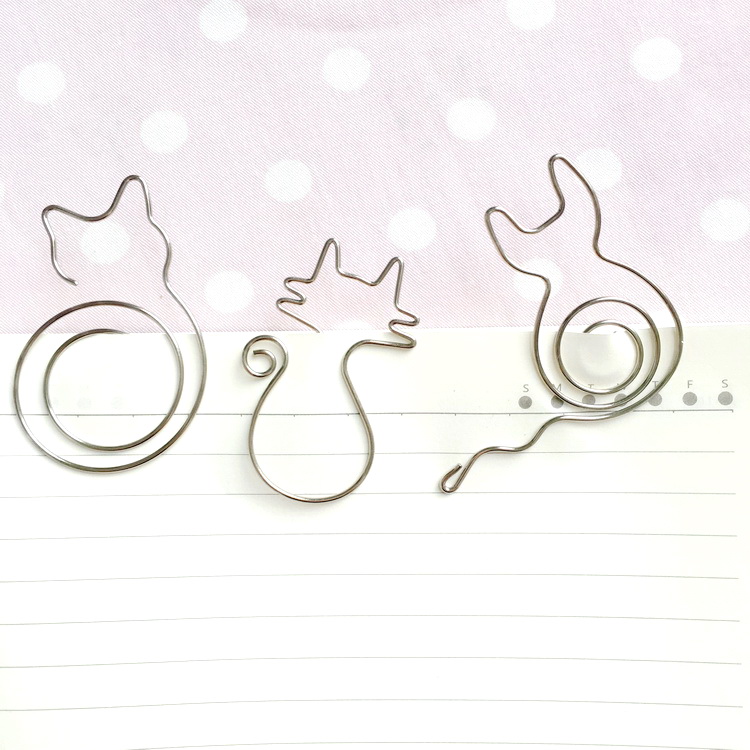 There is a cat cute metal cat shape paper clip creative simple art cat pin bookmark document folder