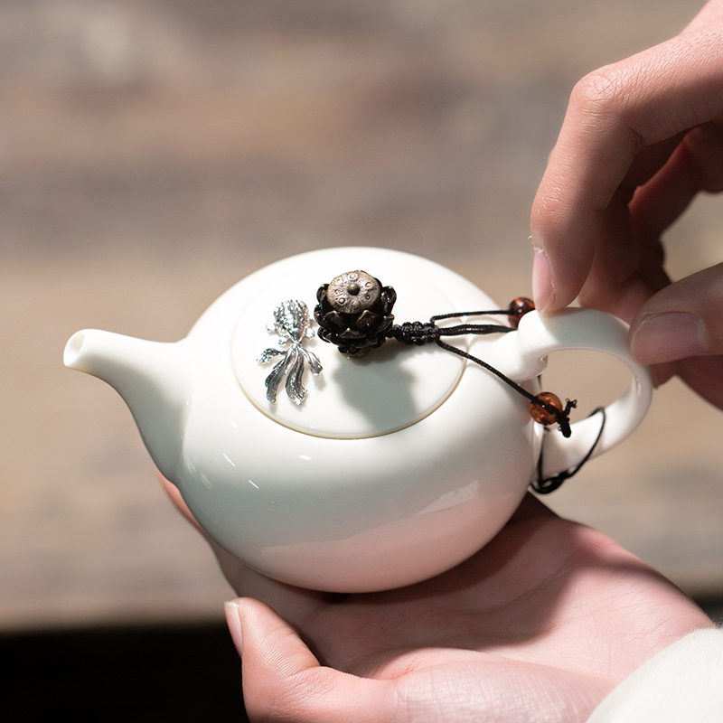 Dehua white porcelain teapot with fish jade porcelain teapot of kung fu tea set rust glaze side the Chinese single pot