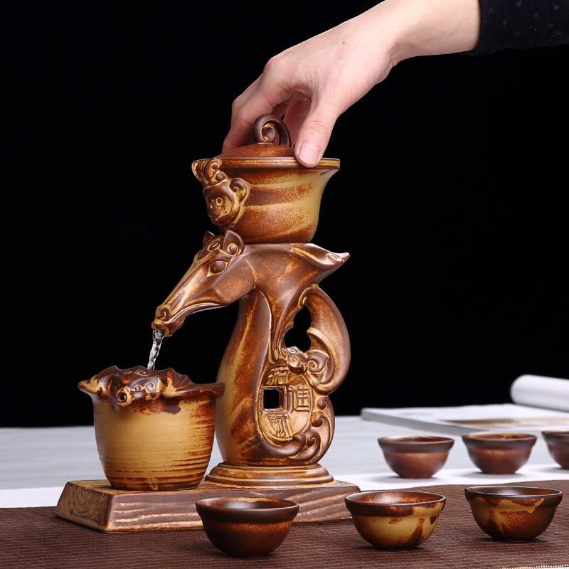 Xin art ceramic semi - automatic edge tea set creative hot tea. Preventer character coarse pottery of a complete set of kung fu tea set