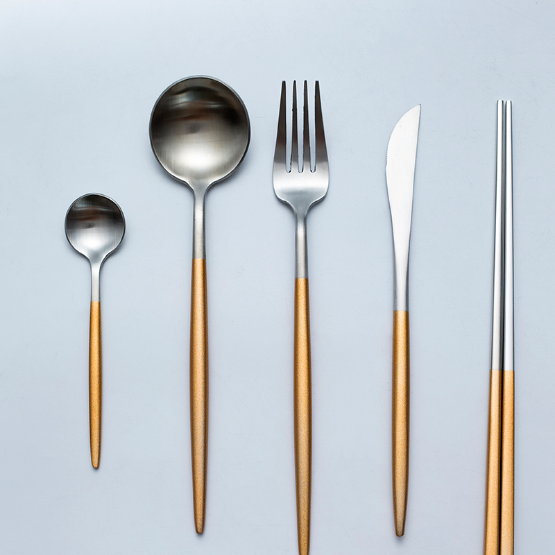 Black and white and gold and silver wire drawing of stainless steel tableware suit beefsteak coffee spoon dinner knife and fork spoon, chopsticks combination