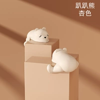 Лежать на медведях и абрикосовом цвете