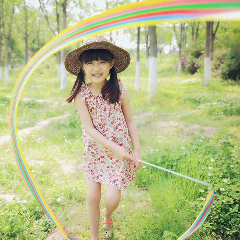 Children's photoshoot in spring, photography, holding props, colorful ribbons, dance performance, street photography, photo composition