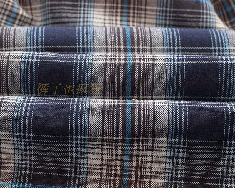 Quần short trung niên nam mùa hè trung niên nam cotton giản dị kẻ sọc năm quần tải quần rộng bãi biển mỏng quần jean đen nam