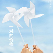 Exterior travel photo wedding photography props plastic white small windmill couple photo beach location photo props