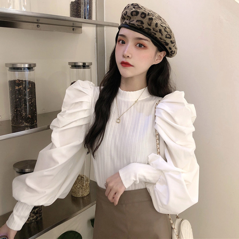 Sweater women spring 2021 new French vintage puff sleeve top design sense long-sleeved wild ocean knitwear