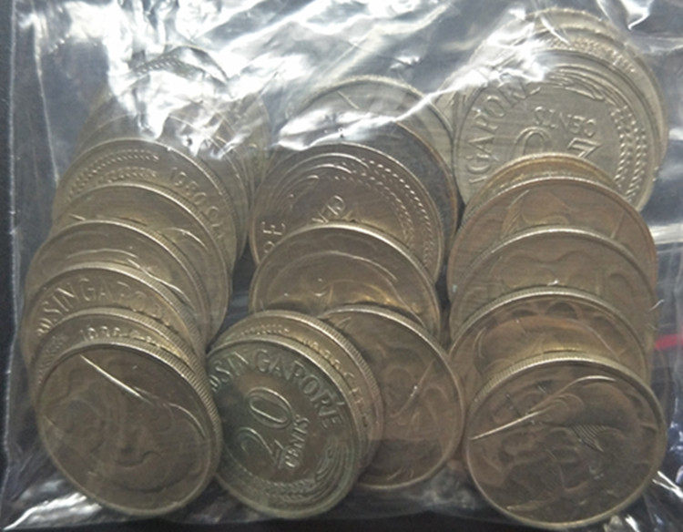 Singapore's first round of 50 20-cent coins are sold with physical photographs as shown in the figure