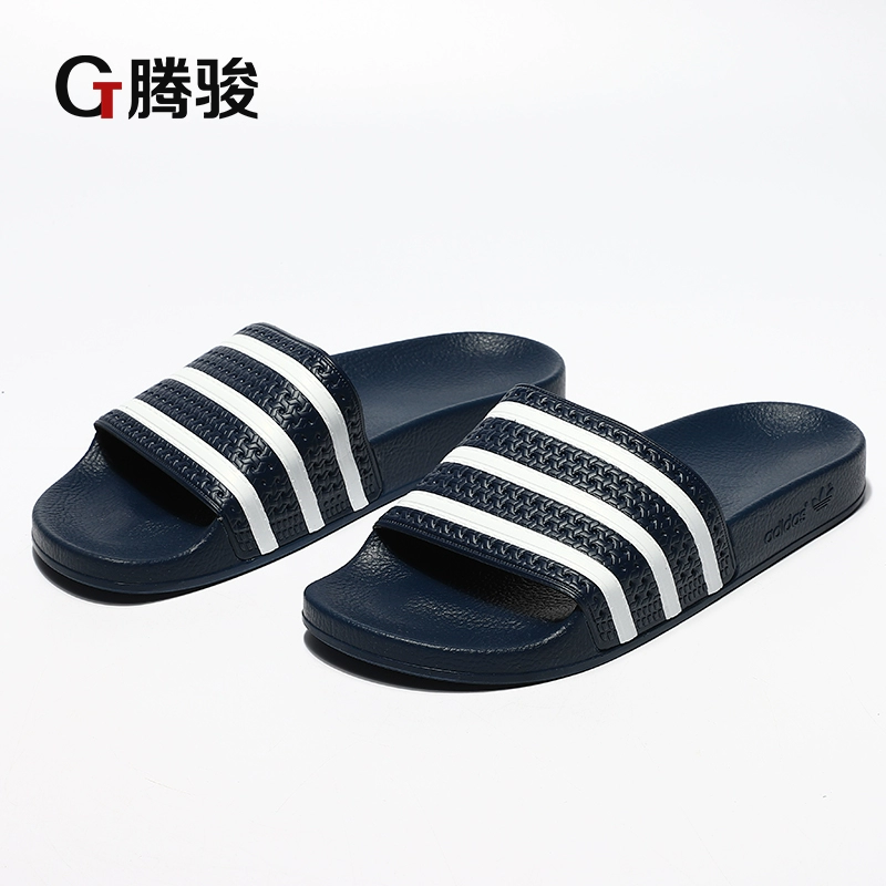 Tengjun Sports adidas Cỏ ba lá ADILETTE Sọc xanh và trắng Nam và nữ Dép thể thao giải trí 288022 dép bitis