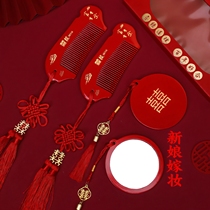 A complete collection of dowry supplies for the bride a small round mirror with wedding inscriptions a pair of high-end mini solid wood cosmetic mirrors and combs for the wedding