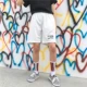 Mùa hè Hàn Quốc ins Harajuku BF gió sinh viên hoang dã năm quần lỏng ba thanh 5 quần ngắn thể thao cho nam và nữ quần short nữ ống rộng