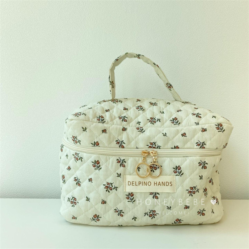 South Korea Ins Mommy Bag Baby Stroller Hanging Bag Large Capacity Broken Flower Makeup Bag Out Of Portable Cartoon Hand Bag