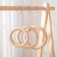 ຮ້ານຂາຍເສື້ອຜ້າໄມ້ແຂງສະແດງຮູບວົງມົນ S hook scarf silk scarf round hanger creative wooden circle magnet bag hanging display rack